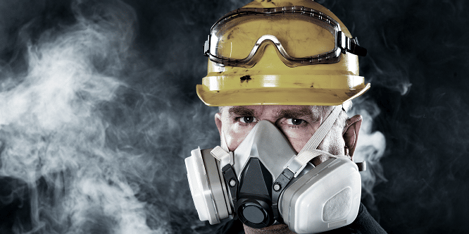 Mining worker wearing a respirator