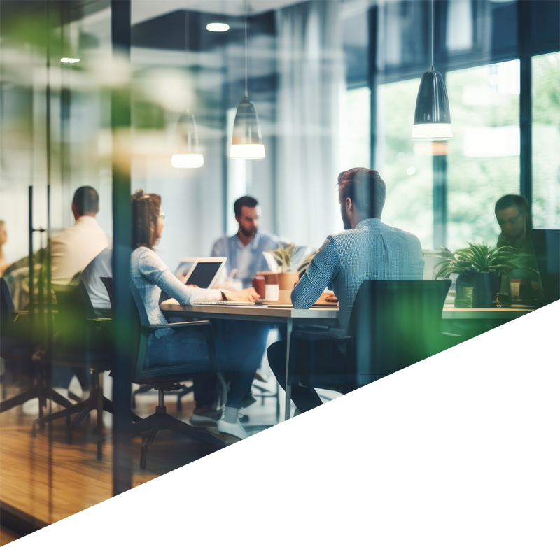 Office workspace with people working and in discussion