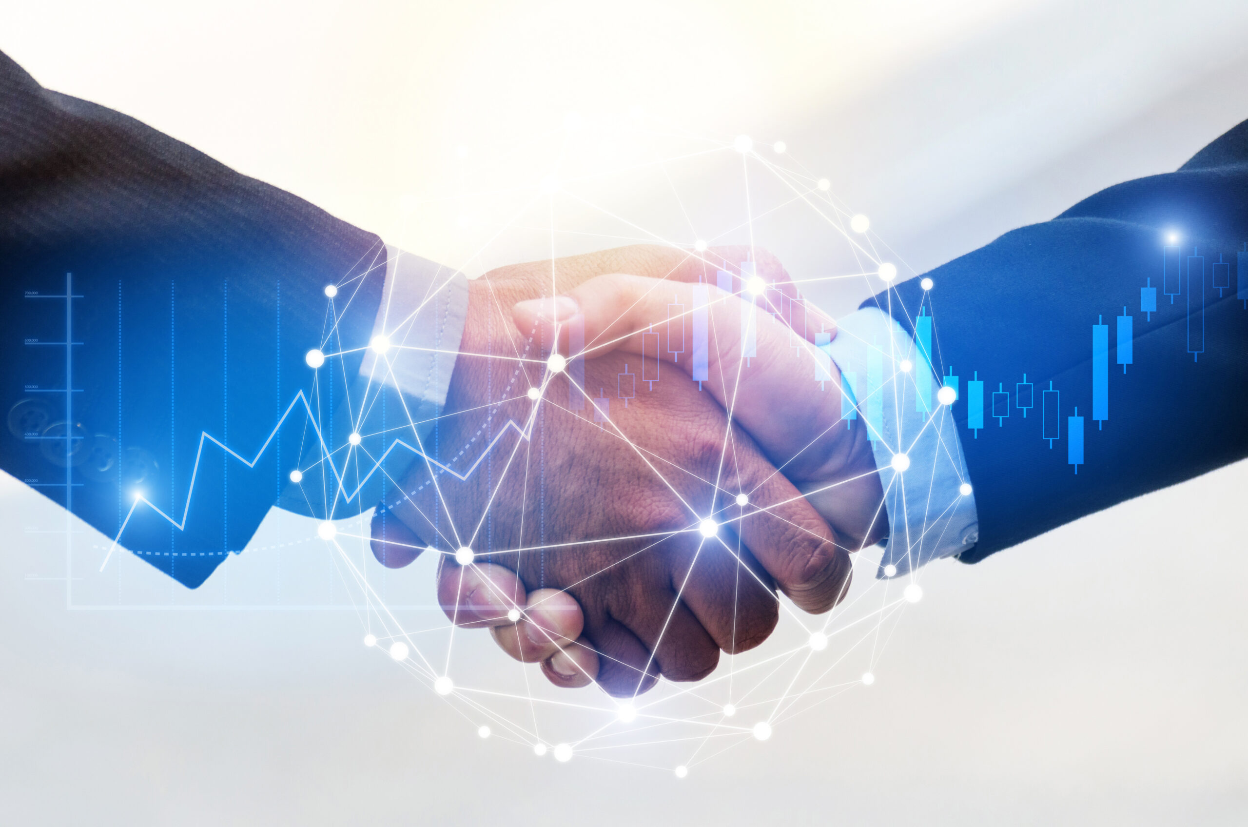 Two business people shaking hands over a network diagram, representing a successful collaboration and strategic partnership.